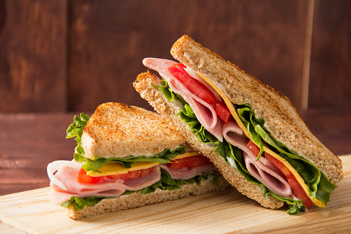 Sandwich bread tomato, lettuce and yellow cheese